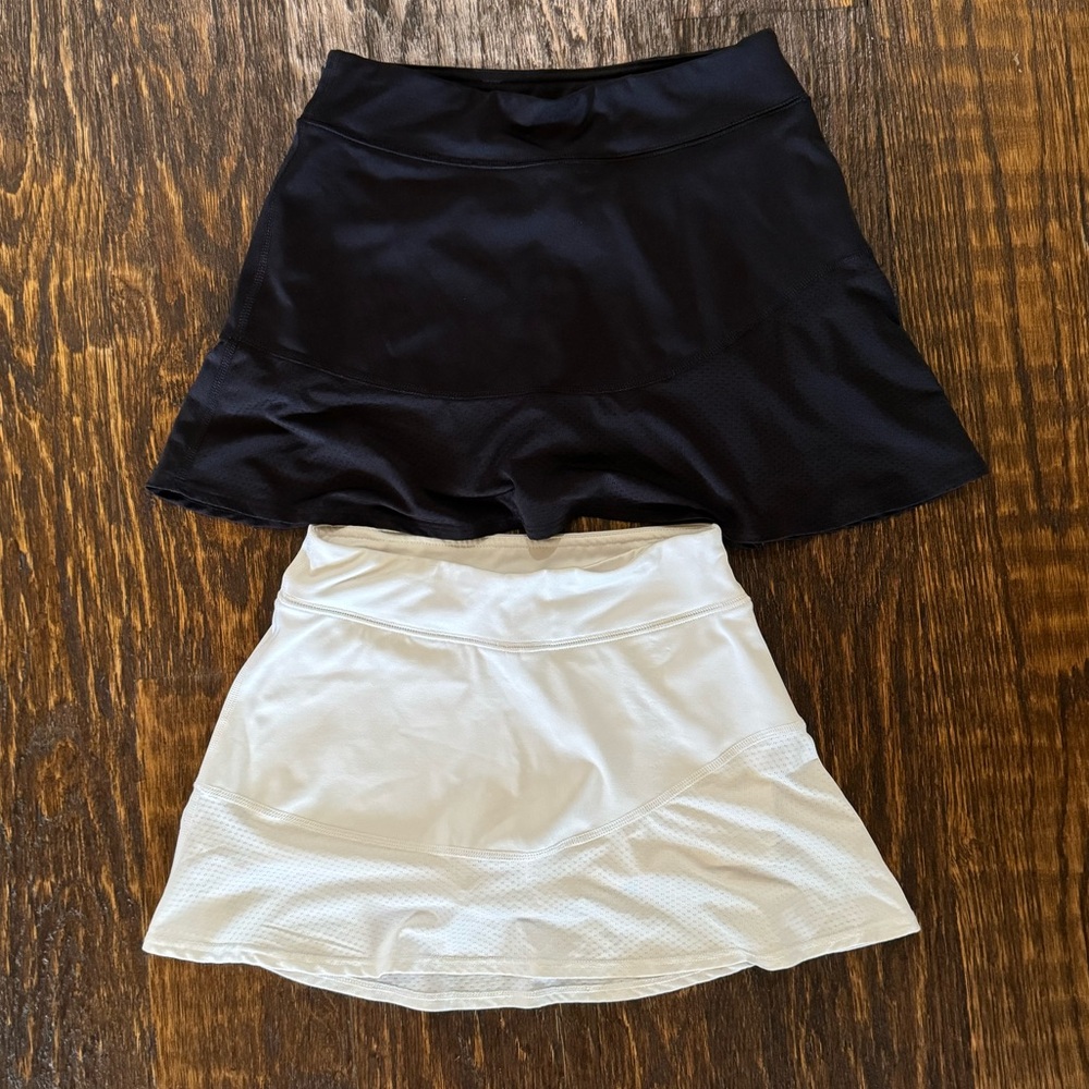 Two girls tennis skirts — size 10/12. Built in shorts and top pocket!